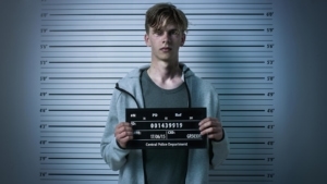 Juvenile defendant posing for a mugshot