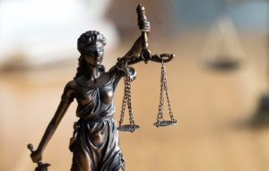 Photo of a small statue of the scales of justice